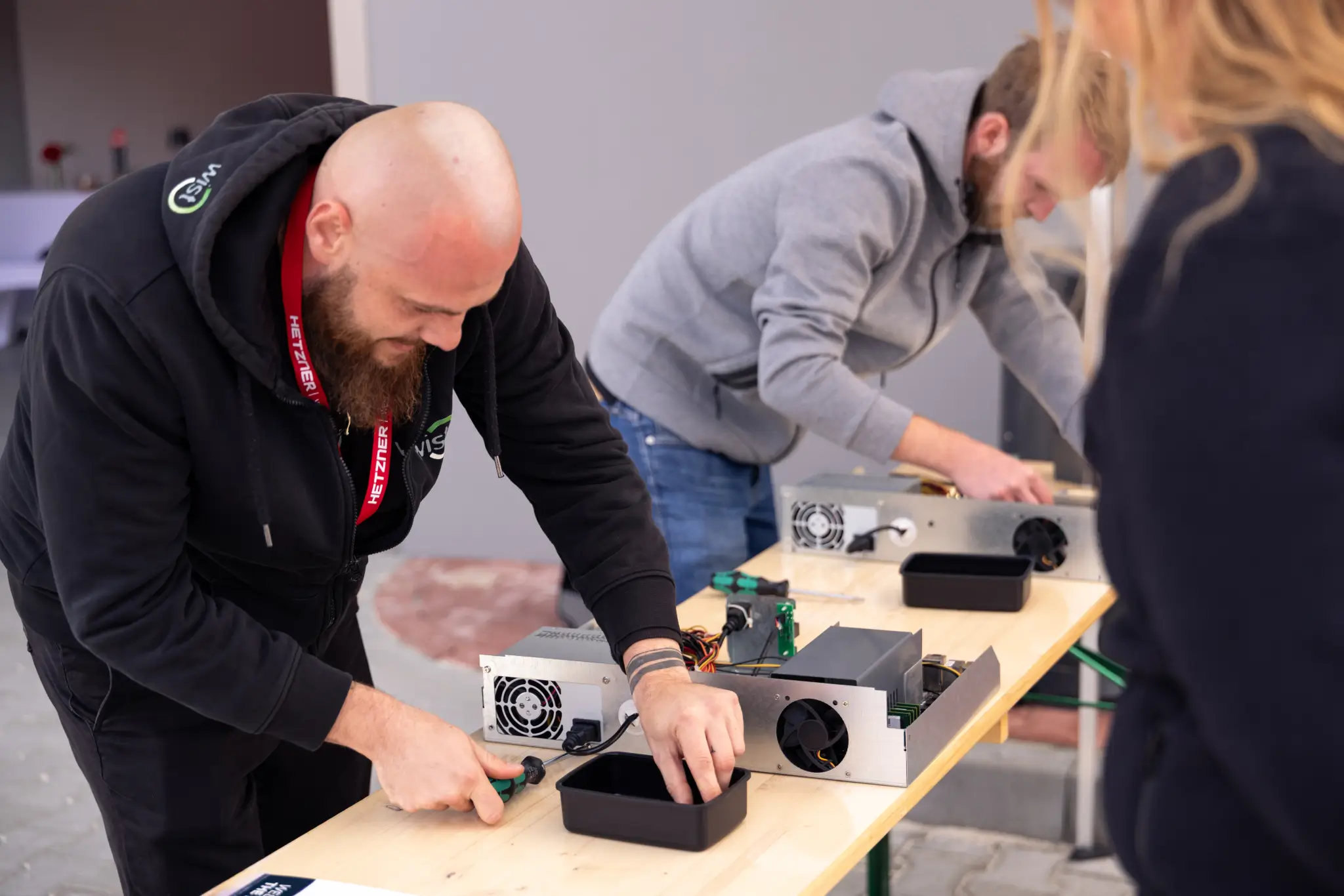 Two people assemble servers at the server building contest.